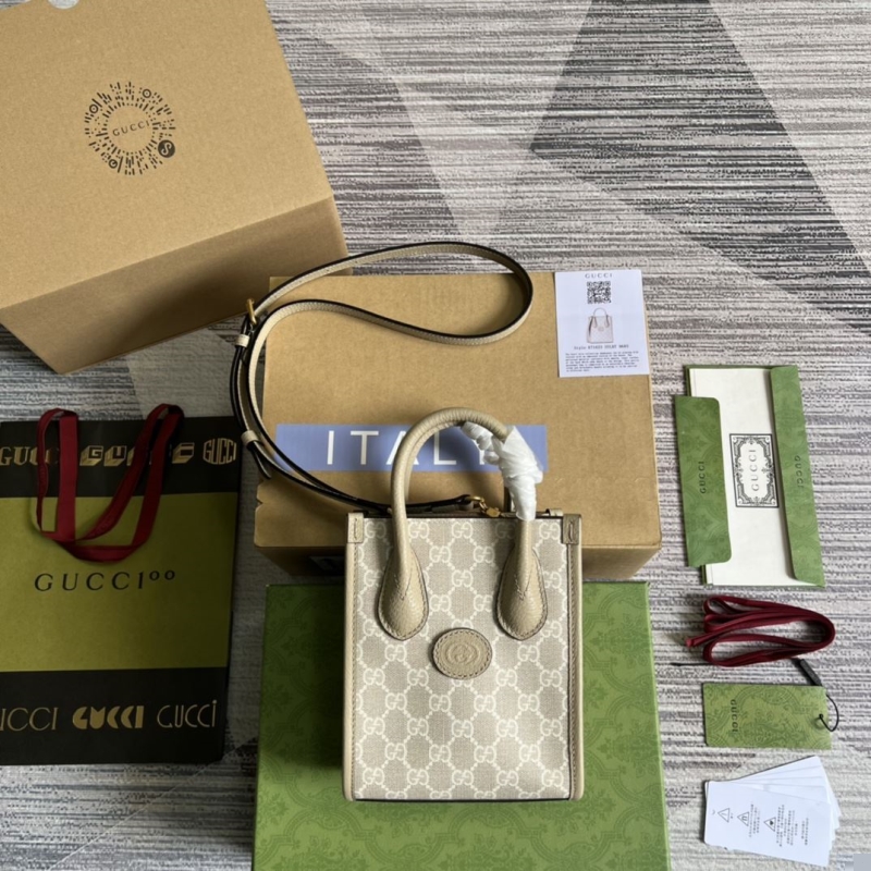 G*u*i top handle bags